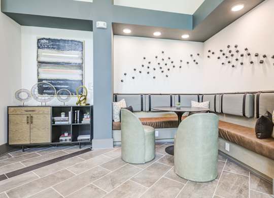 a seating area with two chairs and a tableat Century University City, Charlotte, 28213