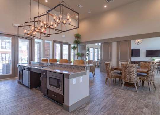 a large kitchen and dining room with a table and chairs at Century Palm Bluff, Portland, Texas