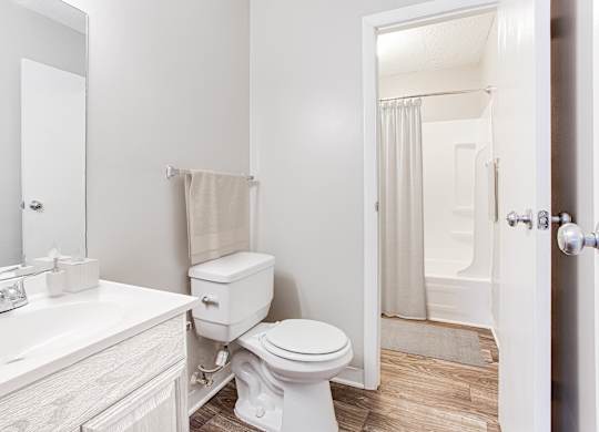 a bathroom with a toilet sink and shower at Lory of Harbison, South Carolina