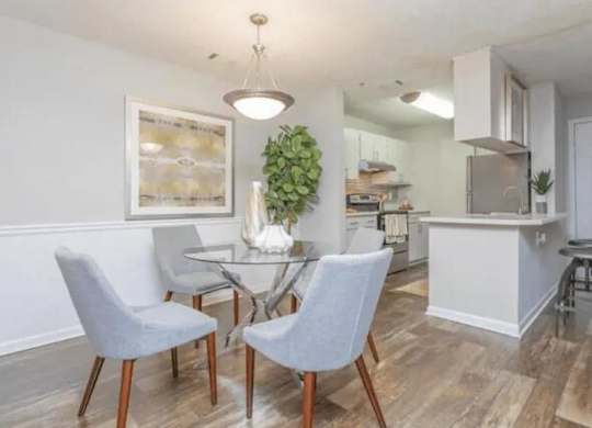 a dining room and kitchen with a table and chairs at The Sapphire, Decatur, GA, 30035
