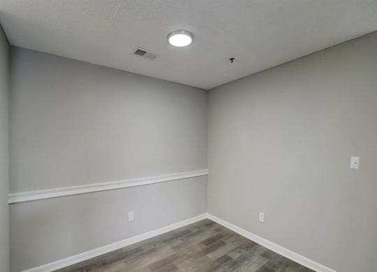 the interior of a room with white walls and wood floors at The Sapphire, Decatur, GA, 30035