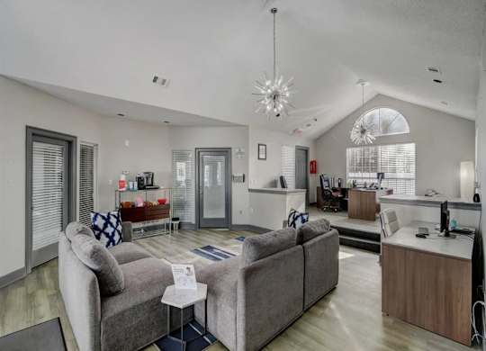 a living room with couches and a table at The Sapphire, Decatur