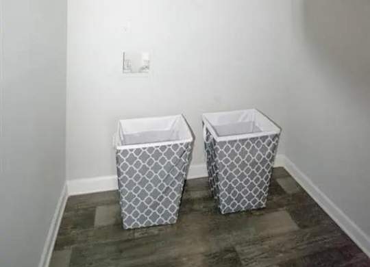 a bathroom with two baskets on the floor at The Sapphire, Decatur, GA