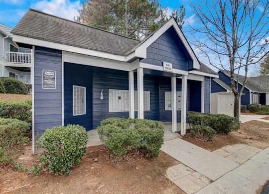 a blue and white house with a sidewalk in front of it at The Sapphire, Decatur, 30035