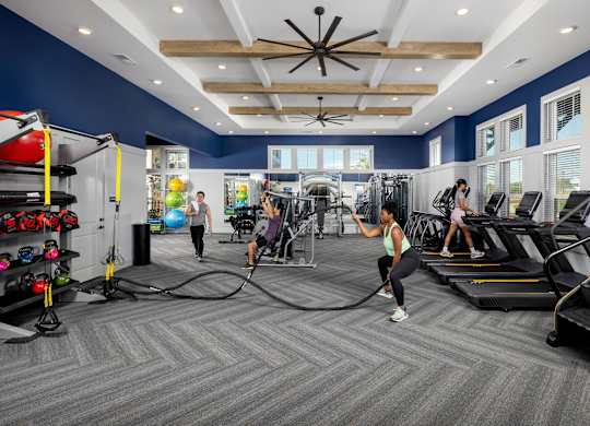 a group of people working out in a gym at Century Mundy Mill Apartments, Oakwood, GA 30566