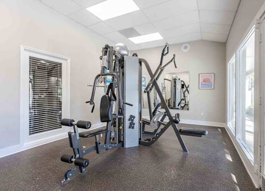 A well-equipped gym with a variety of machines and weights. at Grove at St. Andrews, Columbia, 29210