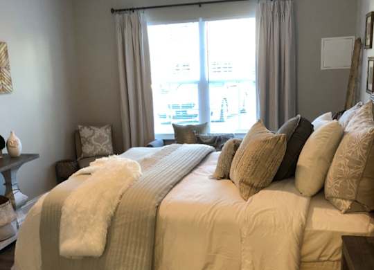 Bedroom With Expansive Windows  at Highland Hills Apatrtments, Grovetown, Georgia