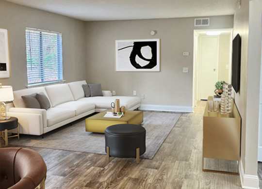 a living room with a wooden floor and a couch and a table