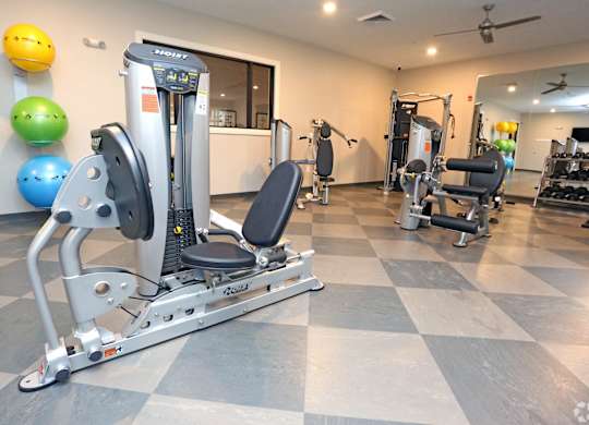 a gym with cardio equipment and weights in a home gym at Century Baxter Avenue, Louisville, 40204