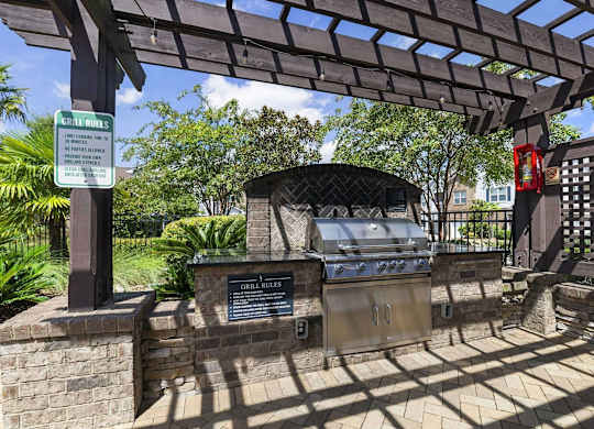 a grill in a park with a wooden pavilion at Century HomePlace, Alabama, 36066