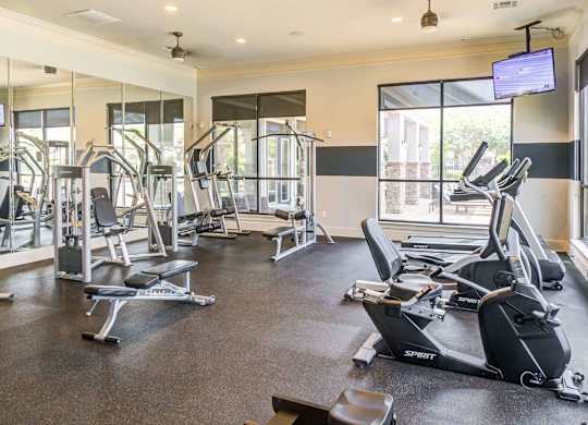 the gym is equipped with state of the art cardio equipment and weights at Century HomePlace, Prattville
