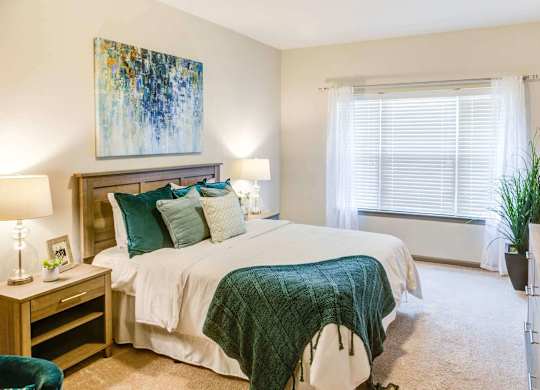 a bedroom with a bed and a window at Century HomePlace, Prattville, AL 36066
