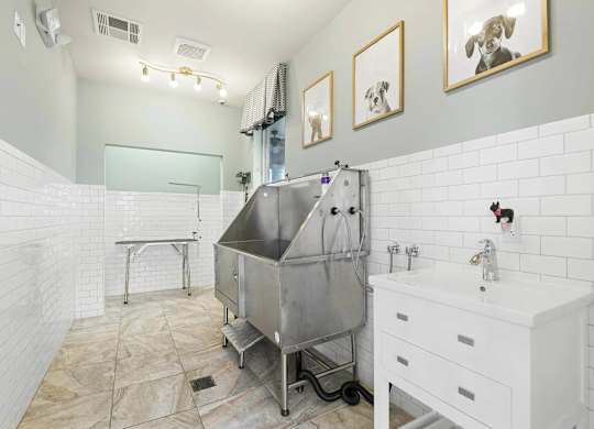 a white bathroom with a stainless steel tub in the middle at Century HomePlace, Alabama, 36066