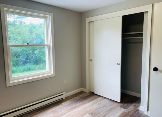 a room with a window and a closet with a door at Briarcliff at Quechee, Quechee Vermont