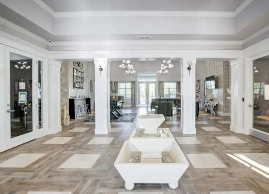 A spacious living room with a white coffee table in the center.at Century Ariva, Lakeland