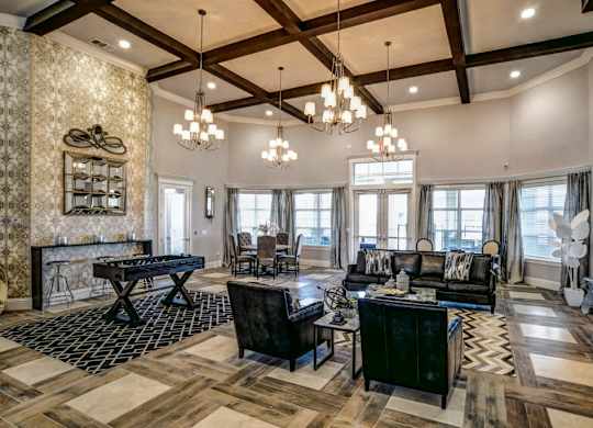 A living room with a black and white checkered rug and a wooden floor.at Century Ariva, Lakeland, 33812
