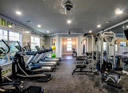 A gym with treadmills, exercise bikes, and other equipment.at Century Ariva, Lakeland Florida