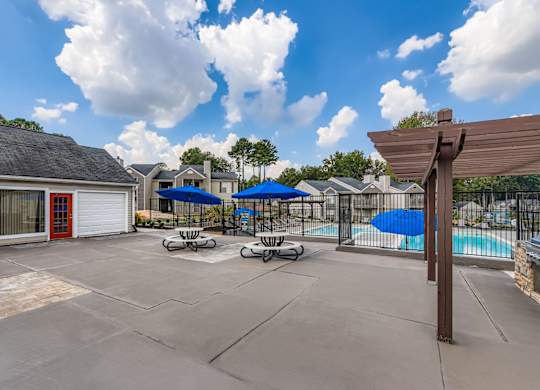 A sunny day at the poolside with a clear blue sky at Keita 1875, College Park, GA