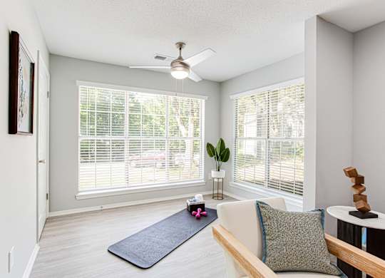 A living room with a yoga mat on the floor at Keita 1875, College Park, Georgia