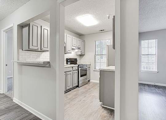 Kitchen And Hallway at Wildcreek Apartments, Clarkston, GA