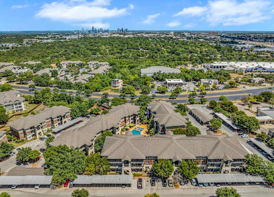 A bird's eye view of a residential area with houses and apartment buildings.