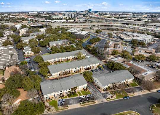 A bird's eye view of a residential area with houses and apartment buildings.