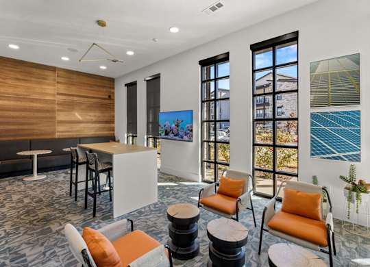 A room with a white table and orange chairs. at Bridge at Tech Crossing, Austin, 78753