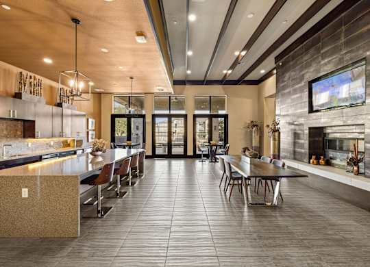 A modern kitchen with a dining table and chairs. at The Royce at 8100, Austin, TX, 78729