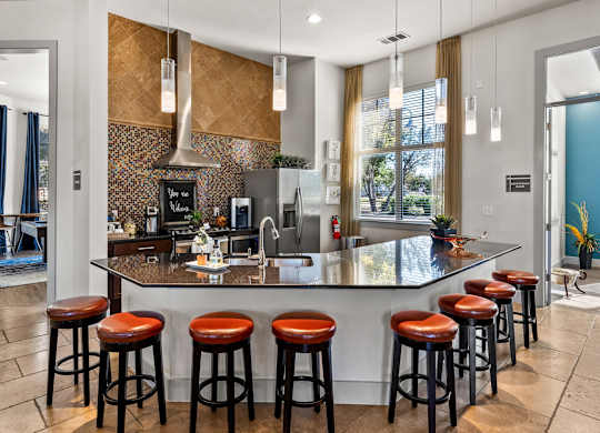 European-Style Kitchen With Breakfast Bar at Bridge at Indigo, Texas