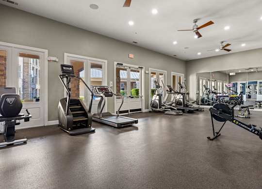 A spacious gym with a variety of exercise equipment. at The James on South First, Austin, Texas