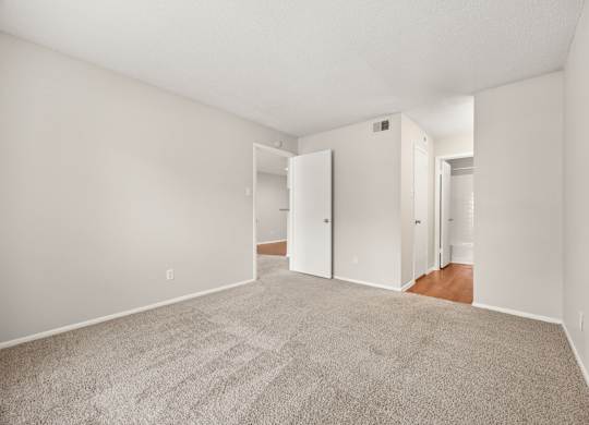 A room with a carpeted floor and white walls. at Montecito, Austin, TX, 78741