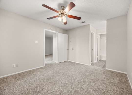 A room with a ceiling fan and carpeted floor. at Montecito, Texas, 78741