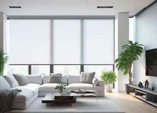 A modern living room with a white sofa, a coffee table, and a large window.