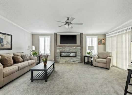 a living room filled with furniture and a fireplace