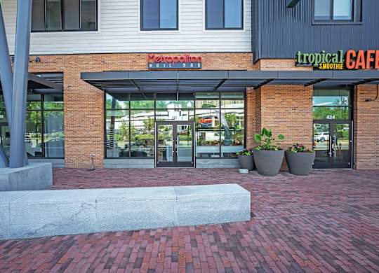 The entrance to a building with a sign that reads
