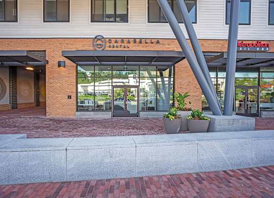 The image shows a building with a sign that reads