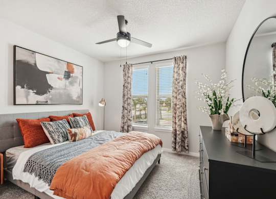 Spacious furnished bedroom in model apartment at The Crossing at Palm Aire