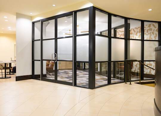 Image showing glass-encased style. A sleek coworking space that’s as polished as it is productive.