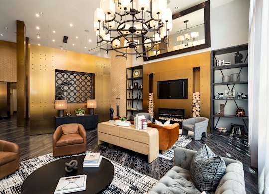 Image showing your stylish gathering place. A two-story lounge with soaring windows and custom furnishings.