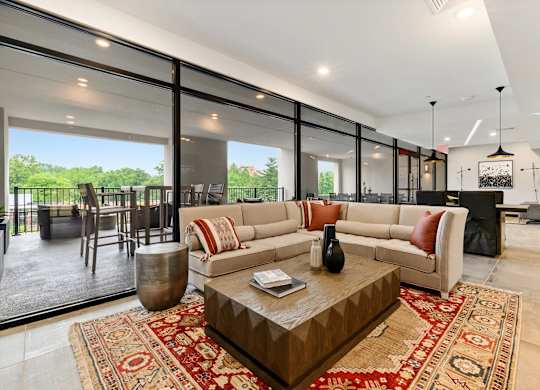 A living room with a large sofa and a coffee table.