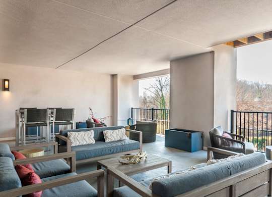 A modern living room with a large sofa and a coffee table.
