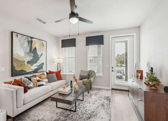 Furnished living room in two bedroom apartment model