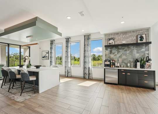 Resident clubhouse at The Crossing at Palm Aire with coffee station and bar seating