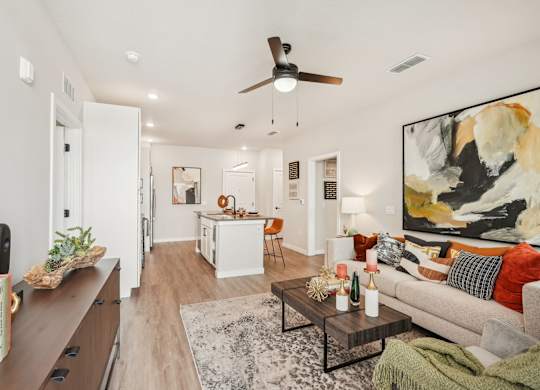 Furnished living room in one bedroom apartment model