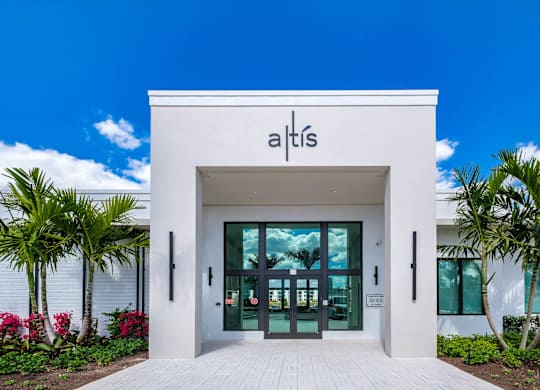 The front of a white building with the name