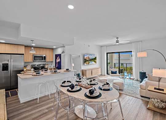 A modern kitchen with a dining table set for four.