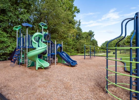 a playground with a slide and monkey bars