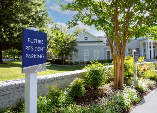 a house with a future resident parking sign in front of it