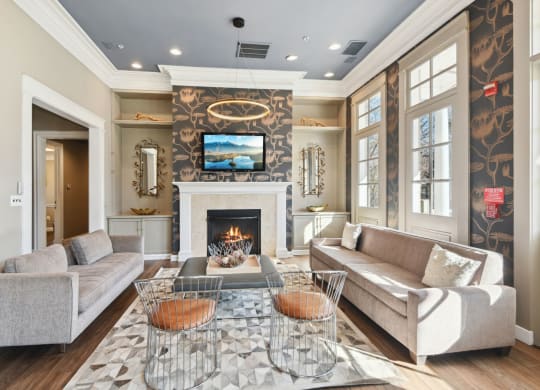 a living room with a fireplace and a tv above it