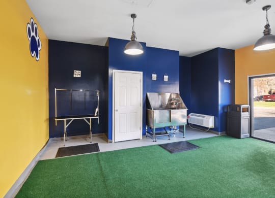 a recreation room with a ping pong table and a chalkboard